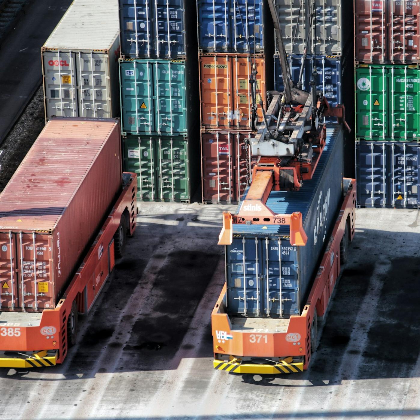 cargo containers are stacked on top of each other